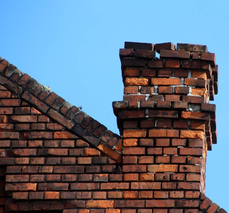 Signs Your Scio Township Home Needs a Chimney Inspection Damaged chimney on an Scio Township home showing cracks and missing mortar